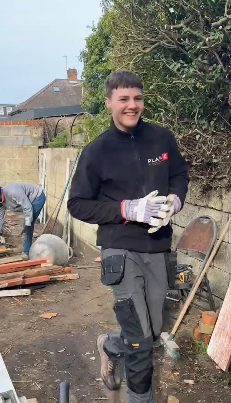 Plan C participant on site with work gloves